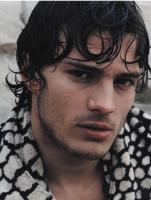 actor Jamie Dornan with long curly hairstyle with long curly bangs.JPG