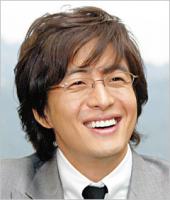 Bae Yong Joon actor with medium long layered hairstyle with long side bangs
