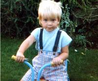 Child picture of Robert Pattinson on his bike.JPG