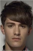 Fashion man short hairstyle with long swept bangs with full of layers.JPG