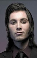 Men black layered haircut with gel side  bangs