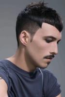 men very short haircut with a cool funky look.JPG