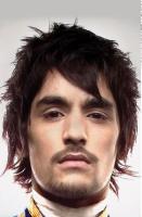Trendy and fashion man medium haircut with full of layers and side bangs.JPG