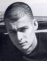 Men's extreme short hairstyle with tribal patterns