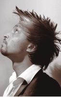 Men spiky haircut with full of layers and highlights and long bangs.JPG