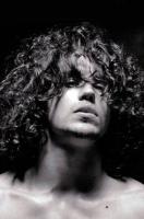 Man curly long hairstyle with very long curly bangs pictures.JPG