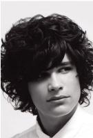 Men light curly hairstyle with long curly bangs.JPG