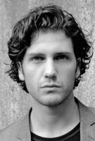 Man medium wavy haircut with layers.JPG