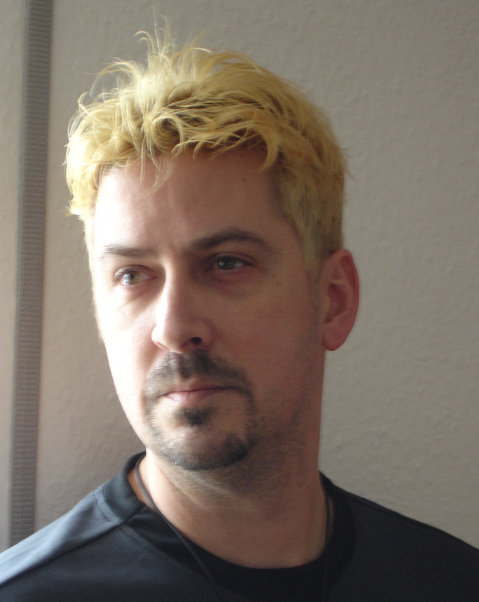 Man very short hairstyle with light blond hair.PNG
