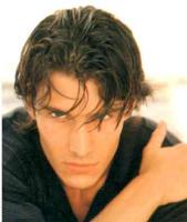 Man layered hair style with waves, brunette