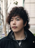 Asian man curly hairstyle with long curly bang and short in the back.PNG