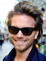 Men hot haircut in medium long length with smooth hair and bangs pulled back.PNG