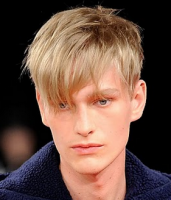 Chic men haircut with long layered bangs with very short hair in the back.PNG
