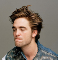 Robert Pattinson in Dossier Magazine with his medium spiky hairstyle and long spiky bangs.PNG