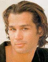 Man long wavy hair style with long bangs, brown