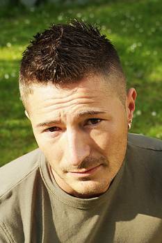 Man very short hairstyle with spicky line in the middle.jpg
